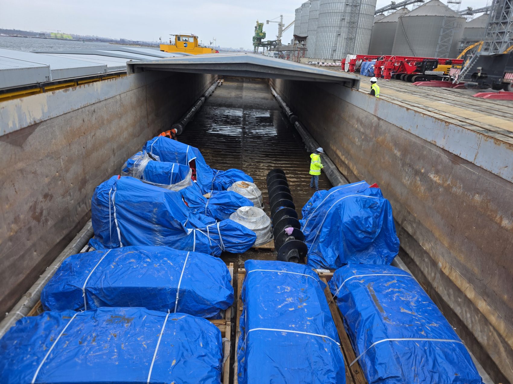 Blue-wrapped cargo in vessel hold