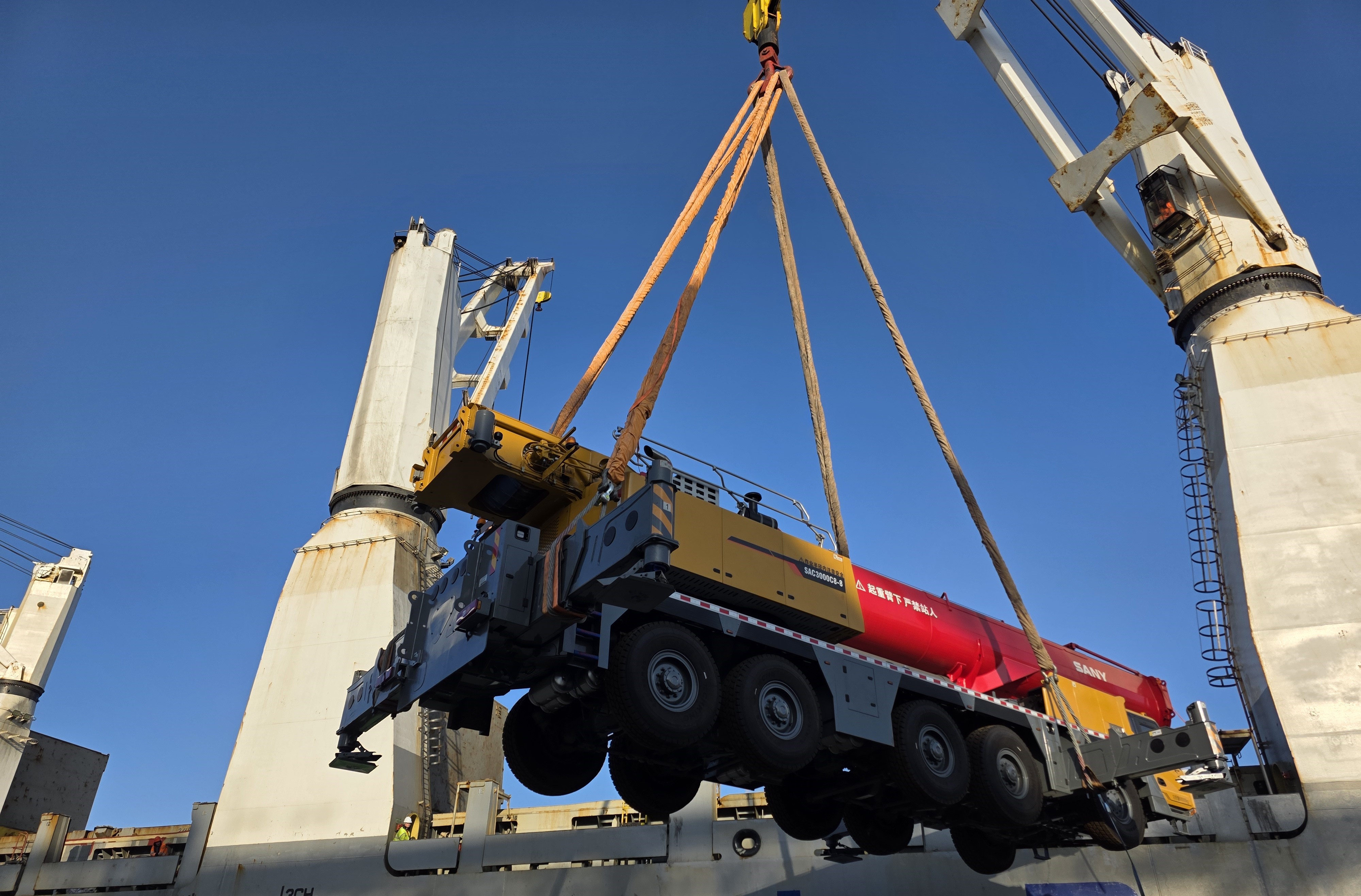 SANY mobile crane suspended by a ship crane